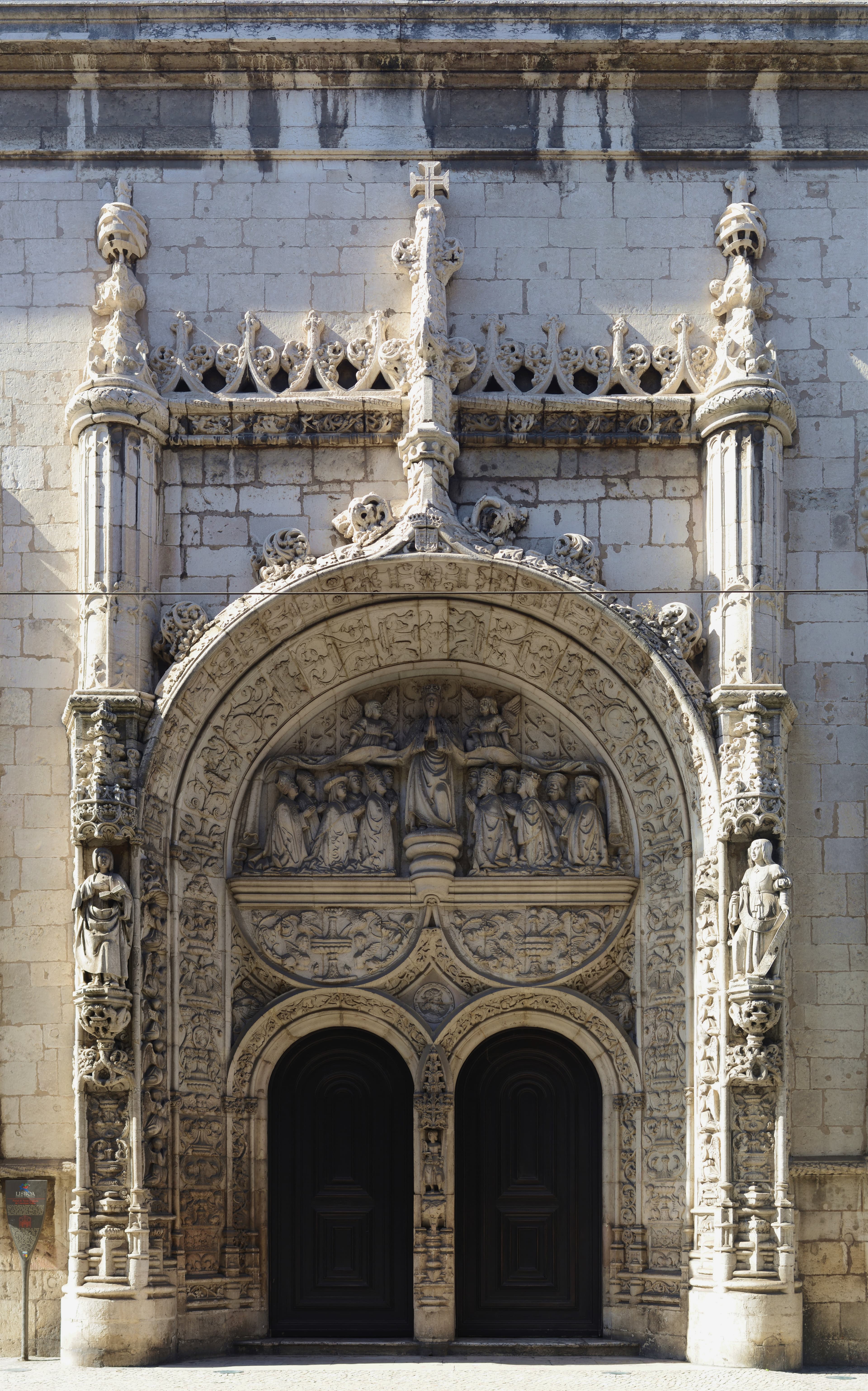 Manueline portal of the Church of Nossa Senhora da Conceição Velha. On the sculpted tympanum is the figure of Nossa Senhora da Misericórdia with her mantle covering several Portuguese personalities from the beginning of the 16th century