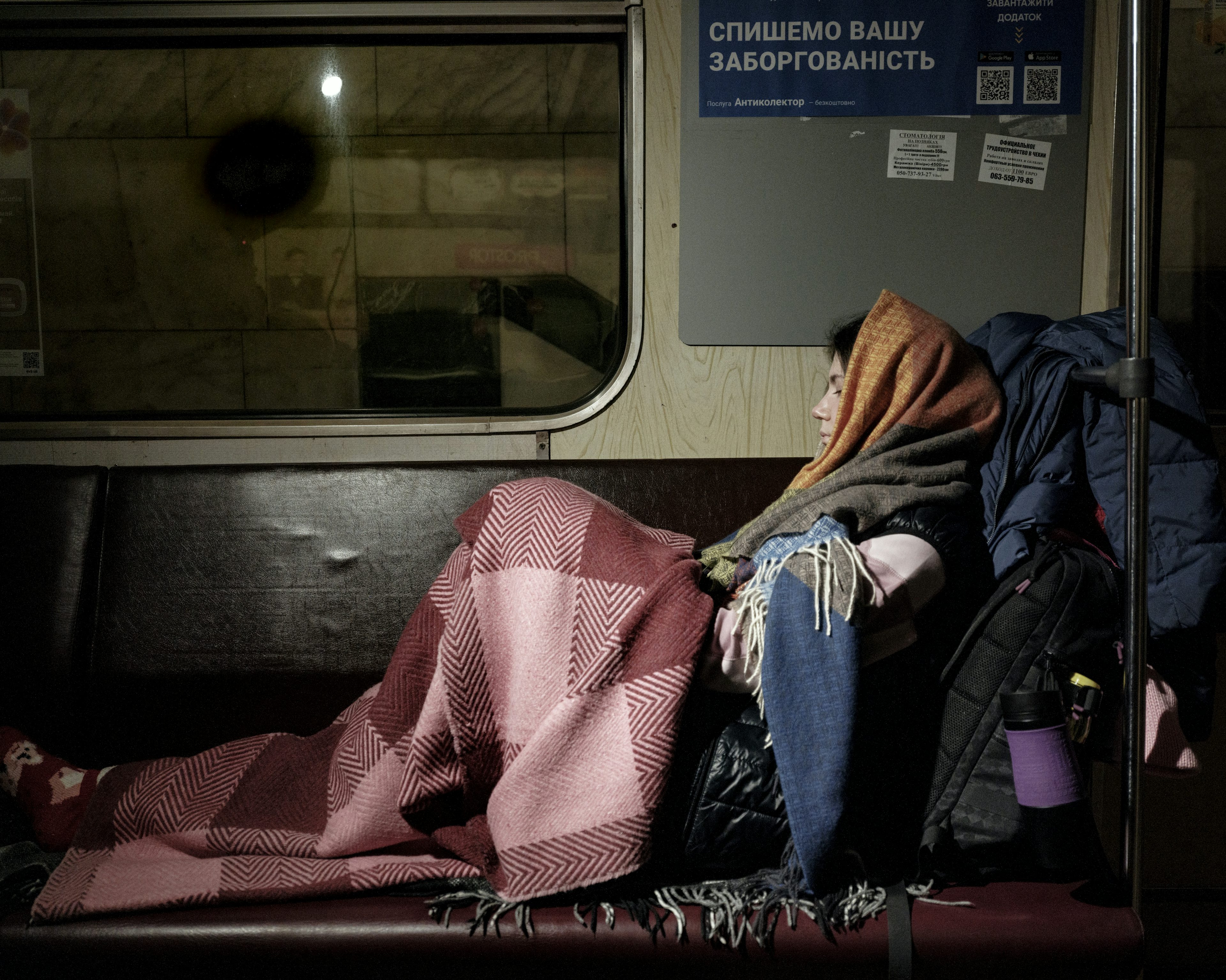 UKRAINE. Kyiv. 4 March 2022. Oksana, a young girl, has moved to live in this metro carriage parked underground to protect herself from the artillery fire of the Russian army. Photo by Lorenzo Meloni