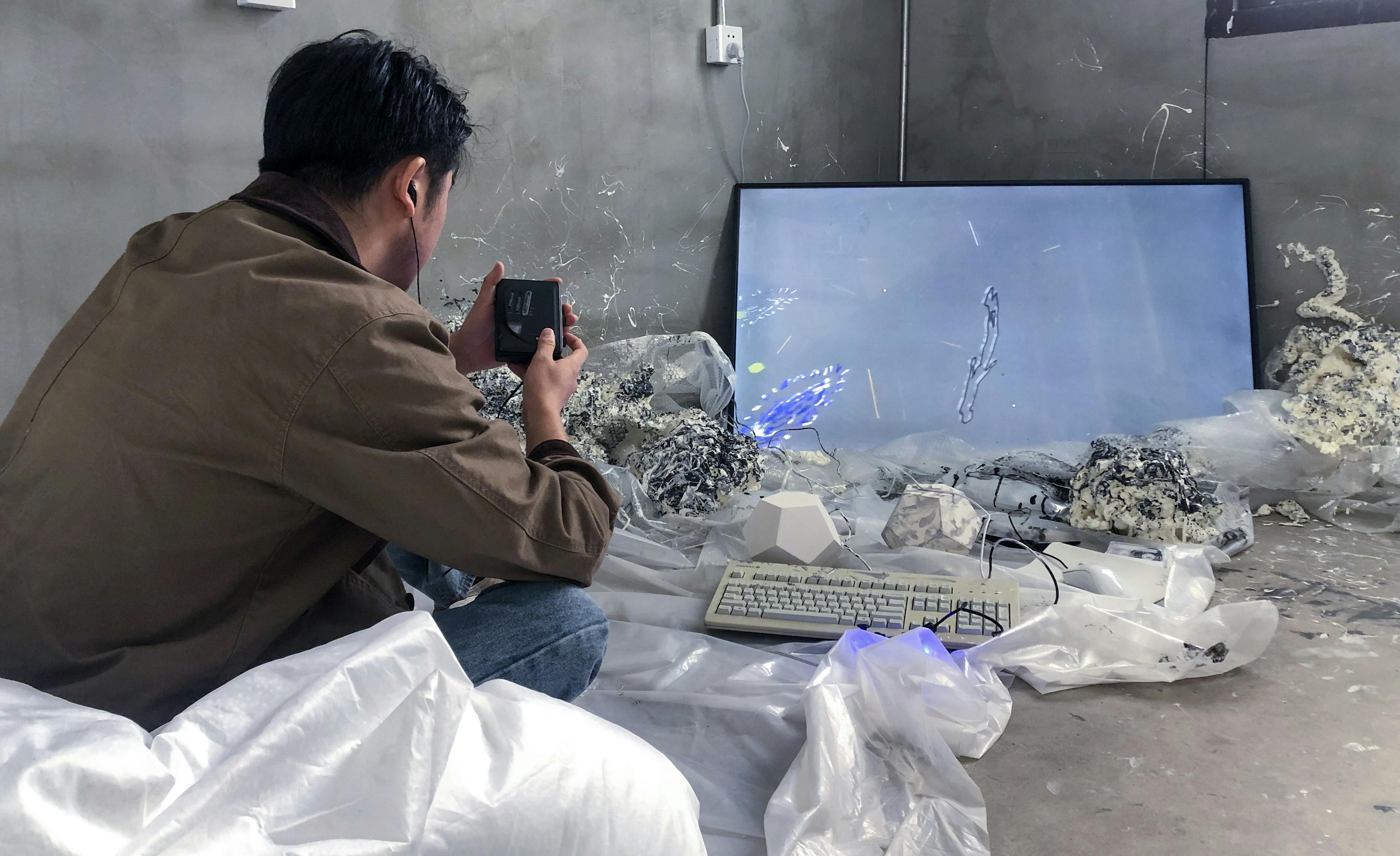 The player listening to the game soundtrack, Linhai, Zhejiang, China, 2022, Courtesy of the artist, Fengyuan Tian, Yurui Dong, and With in/out Linhai