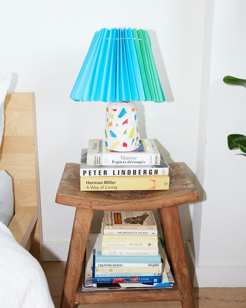 Duda's bedside table, topped with a lamp base and shade she made herself.
