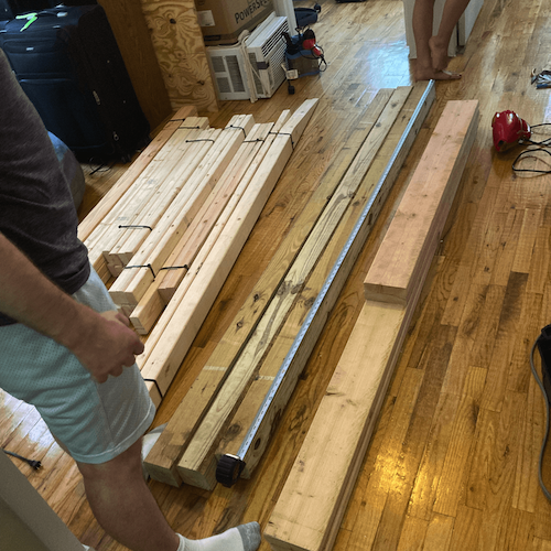 The loft’s pieces arrived and are splayed on my apartment floor, which became our woodworking shop. 